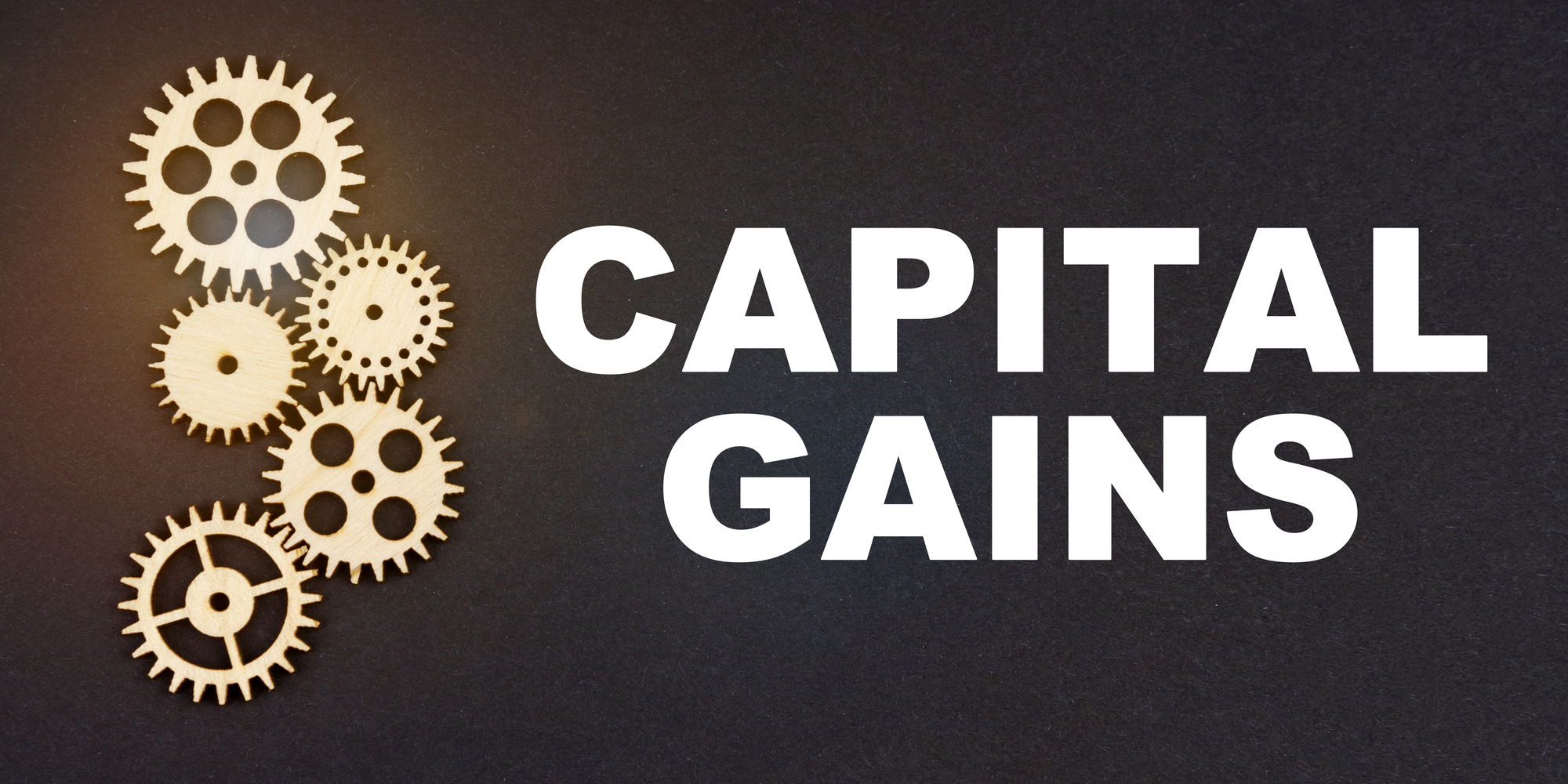 Business and industry concept. On a black background, gears and the inscription - CAPITAL GAINS