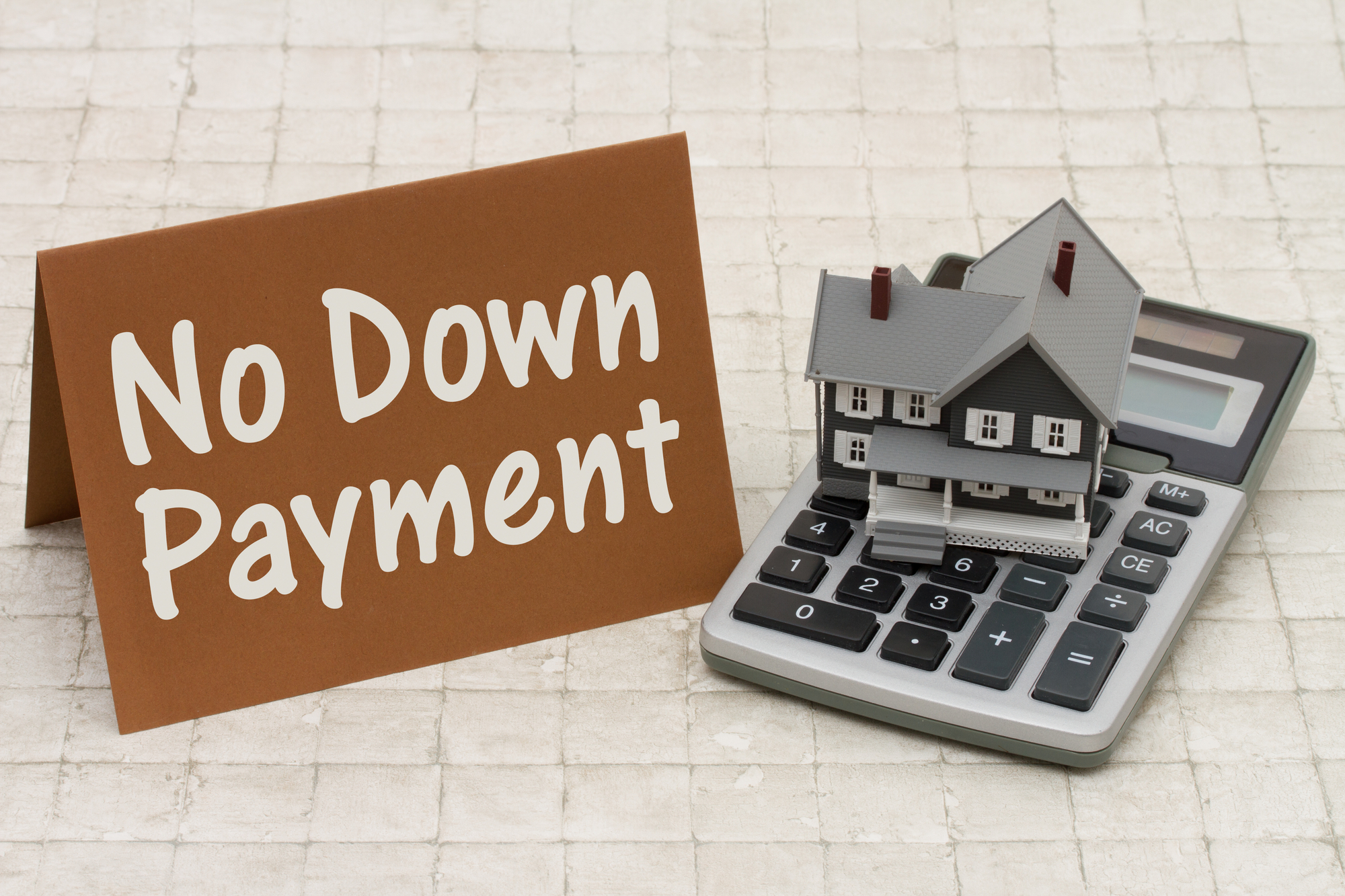 Home Mortgage No Down Payment, A gray house, brown card and calculator on stone background with text No Down Payment